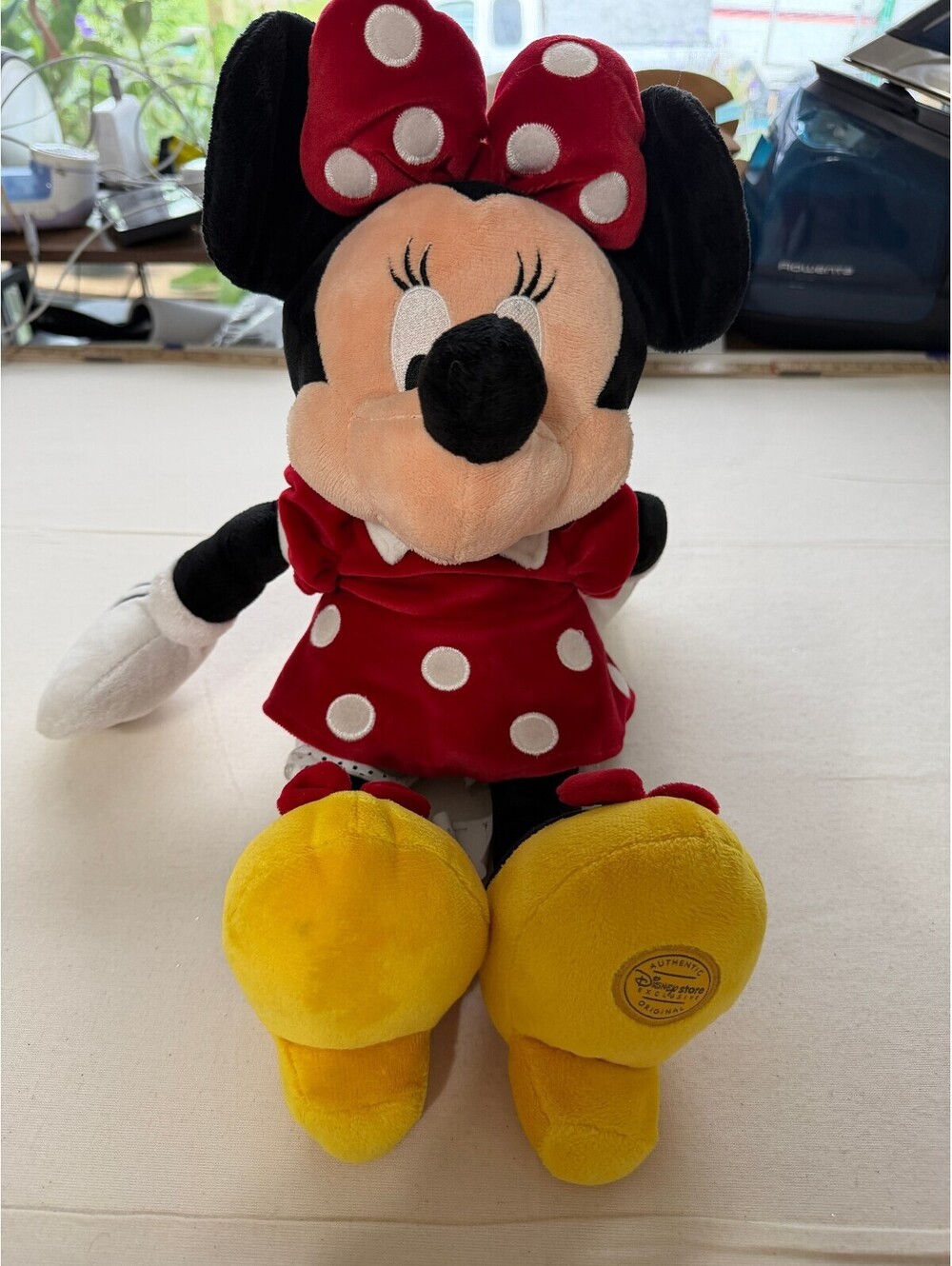 Disney Store Minnie Mouse plush toy in red polka dot dress